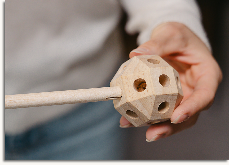 Child building with wooden construction pieces